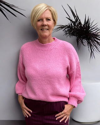 Gebreide trui in roze