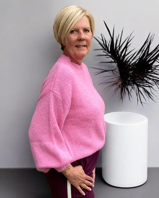 Gebreide trui in roze
